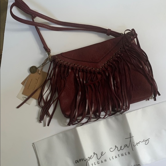 Ampere Creations Handbags - NWT Ampere Creations Burgundy Fringe Crossbody Bag W/ dust bag.